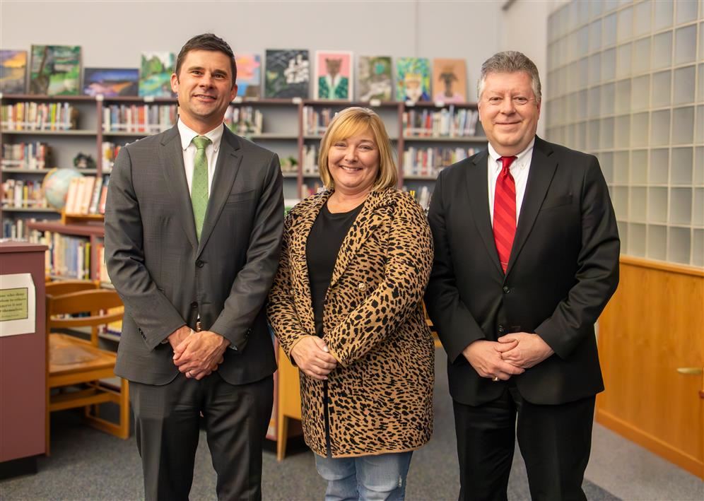 Pictured, from left, are Mr. Phillip Johnson, Board President Jennifer Michalec, and Daniel Pacos